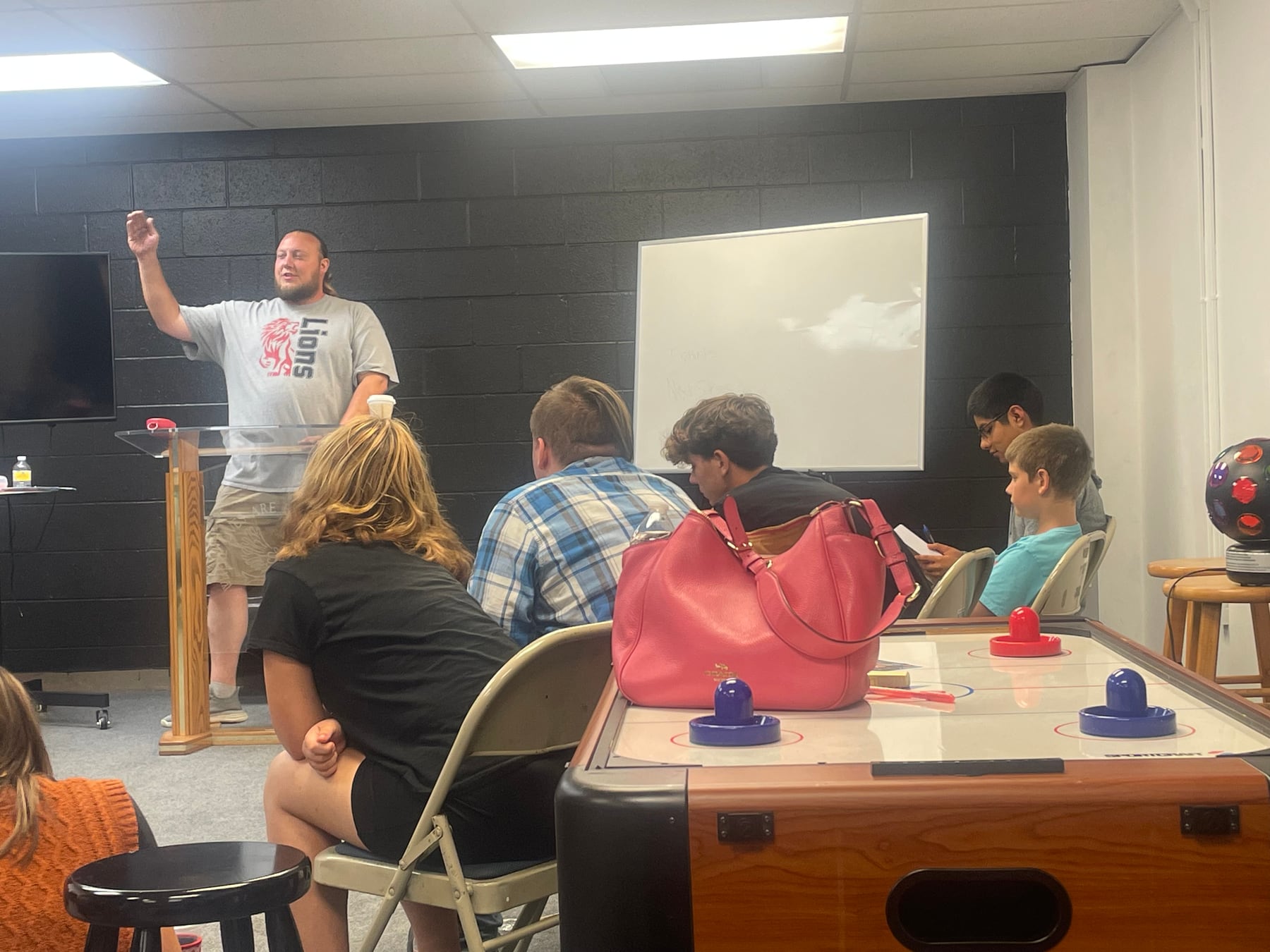 A GT Youth leader teaching students in their ministry room